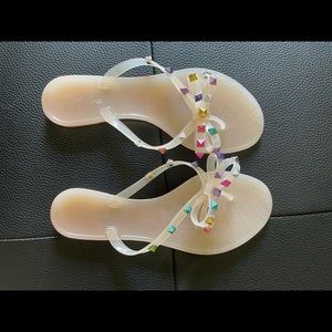 Rainbow embellishment sandal. Sandal is nude.